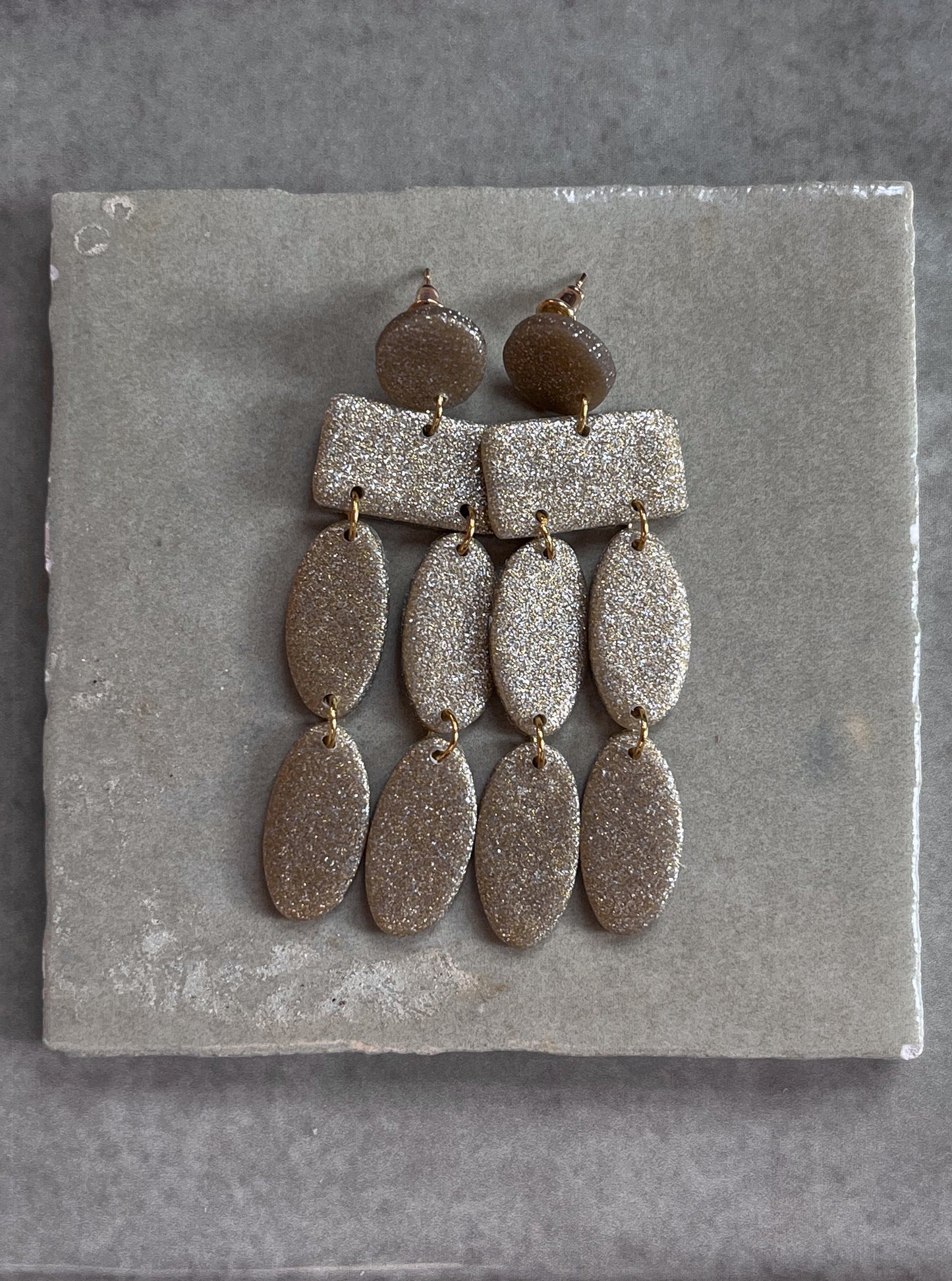 Christina Dangles in a Sparkled Gold
